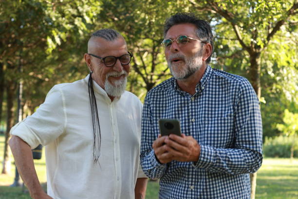istock Senior friends modern men having fun in nature 1938155766