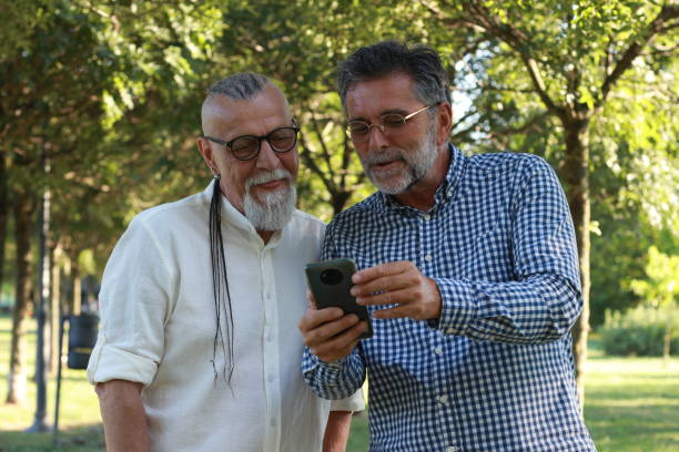 istock Senior friends modern men having fun in nature 1938156289