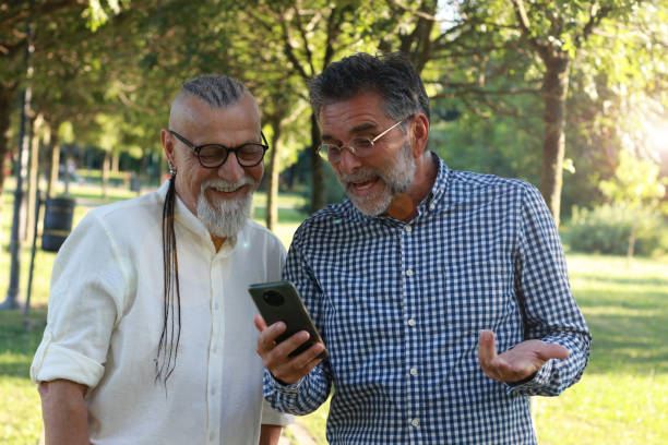 istock Senior friends modern men having fun in nature 1938156385
