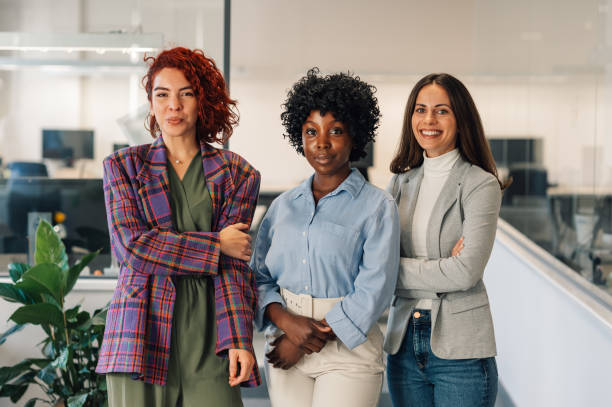 istock Diverse business women with folded arms posing in the office 1938200227