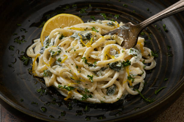 Creamy Ricotta, Lemon and Spinach Spaghetti stock photo