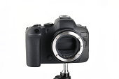 Big Black and Modern digital mirrorless Camera full frame sensor with lens on white background.