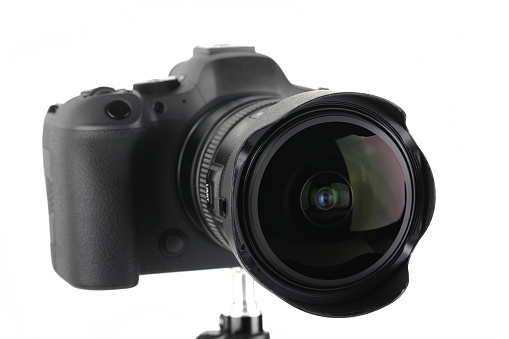 Big Black and Modern digital mirrorless Camera full frame sensor with lens on white background.