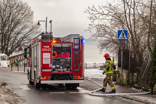 Gdansk, Poland - January 14, 2024: red fire truck in the yard of the fire in Gdansk, Poland. New rescue equipment for emergency situations