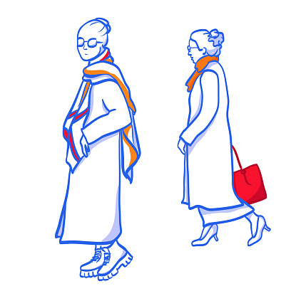Long winter coat fashion, two women walking by.