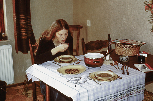 Just married young Woman having Dinner back in the 70s