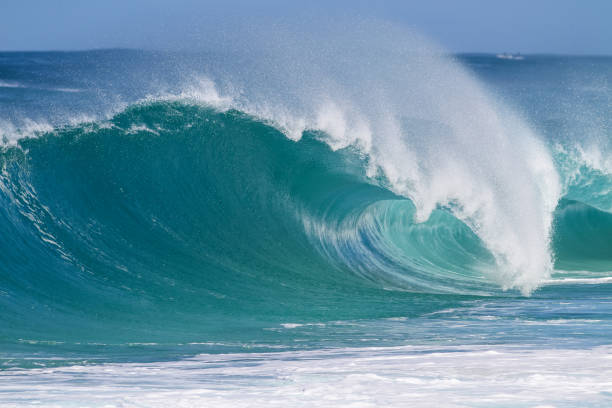 istock Big waves break at famous Keiki's shore break, North Shore 1938386661