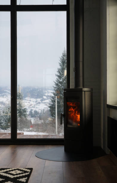istock Modern fireplace in a cozy house with mountain view 1938411594