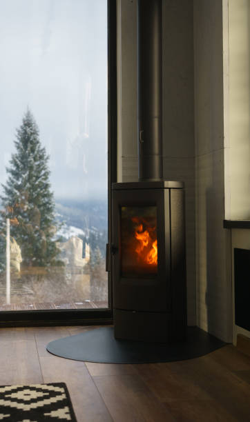 istock Modern fireplace in a cozy house with mountain view 1938411610