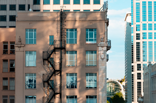 Steel fire escaps on exterior of building with decorative accents in Seattle, Washingon