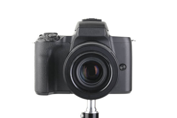 istock Black and Modern digital mirrorless Camera with lens on white background. 1938467068
