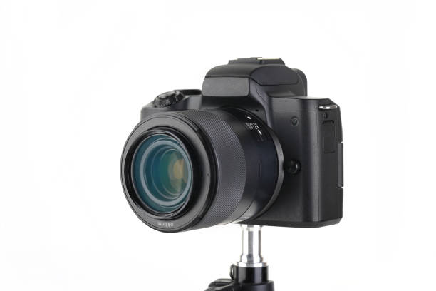 istock Black and Modern digital mirrorless Camera with lens on white background. 1938467072
