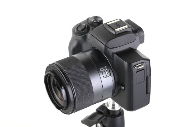 istock Black and Modern digital mirrorless Camera with lens on white background. 1938467077