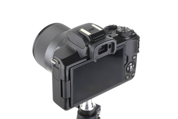 istock Black and Modern digital mirrorless Camera with lens on white background. 1938467078