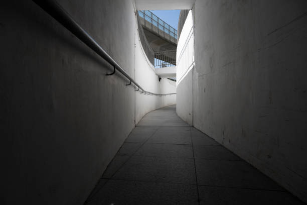 istock Narrow public pedestrian walkway by the overpass 1938529370