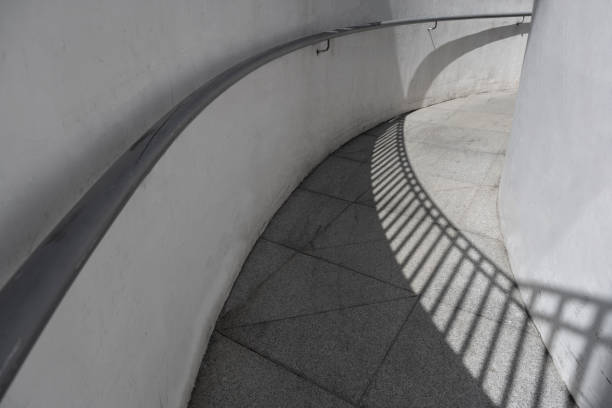 Narrow public pedestrian walkway under the overpass