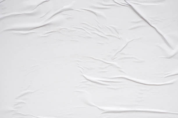 istock White blank crumpled and creased paper poster texture background 1938534761