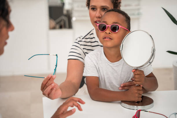 istock Mother and Son Exploring Fashionable Eyewear Options 1938536360