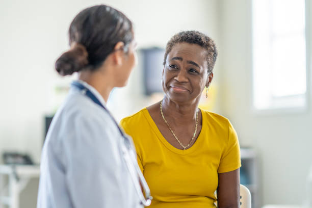 istock Doctor Talking with a Senior Patient 1938542767