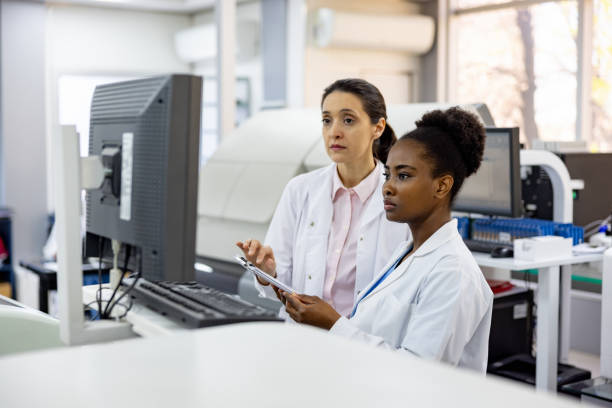 istock Team of scientists working at a laboratory doing research 1938554544