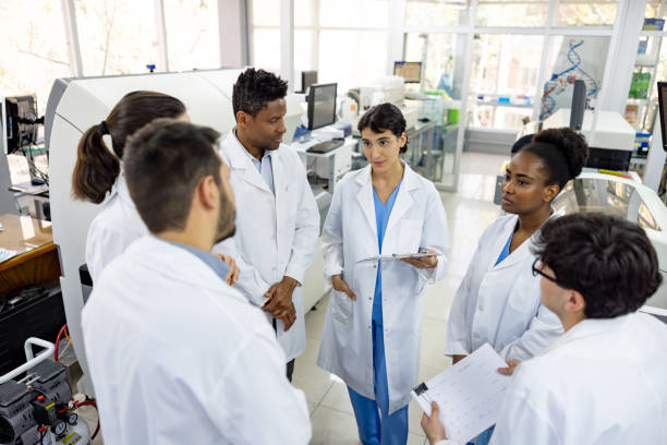 istock Group of scientists talking in a meeting at the laboratory 1938555089