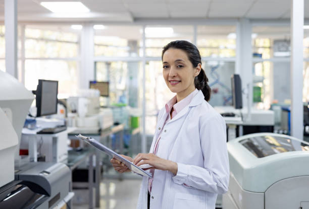 istock Doctor working at the laboratory and holding a clipboard 1938555119