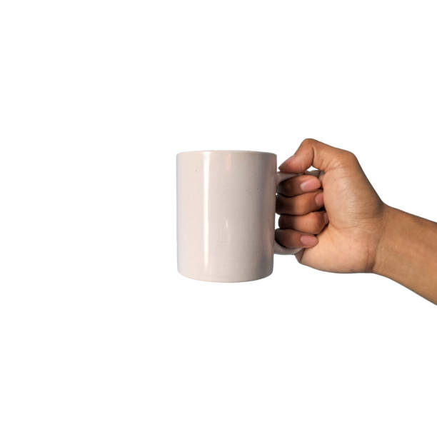 istock Man's hand holding a cup isolated on white background 1938559393
