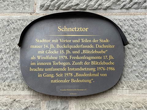 Information board about this Schnetztor gate as part of the old city wall from the 15th century in Konstanz on Lake Constance - Germany.