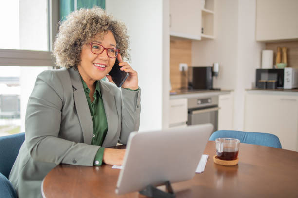 istock Mature woman working from home 1938588350
