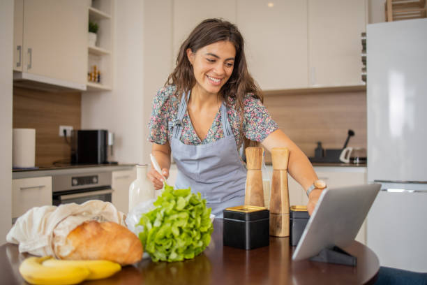 istock Young woman is preparing a meal 1938592412