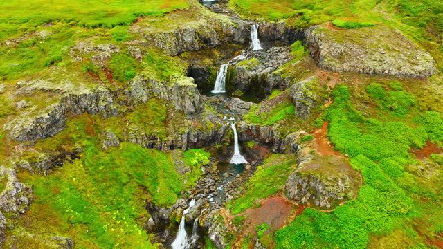 Spectacular waterfalls in mountains, Beautiful aerial view from Iceland in summer season, Icelandic highlands, Wild river with cold glacial water