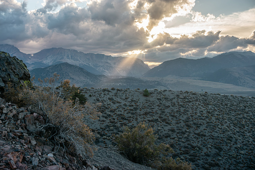 A mountain view with the sun setting in the distance at Mono Lake.