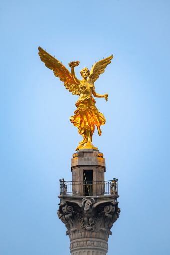 The Angel of Independence statue on Reform avenue in Mexico city at midday