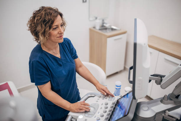 istock Female doctor working on ultrasound scanning machine 1938702162