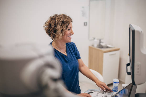 istock Female doctor working on ultrasound scanning machine 1938704775