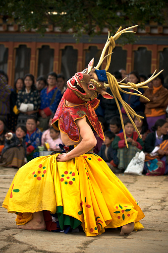 Hanoi, Vietnam - February 27, 2016: Asian civilian artists performing a public spiritual dance outdoor within a festival to welcome lunar new year in Hanoi capital, Vietnam.