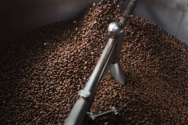 istock Medium Roast coffee beans roasting process.Medium-brown color, may have some oil on the surface of the beans. 1938747020