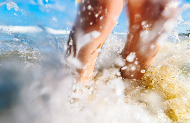 Splashing feet on the beach