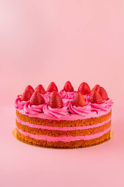 istock delicious strawberry cake on a pink background 1938841373