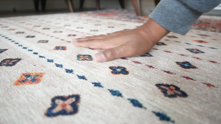 hand touching new home carpet