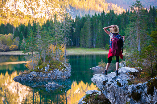 Discovery Hike for an Adult Female Backpacker in the Scenic Alpine Environment of Fusine Lakes, Tarvisio Italy