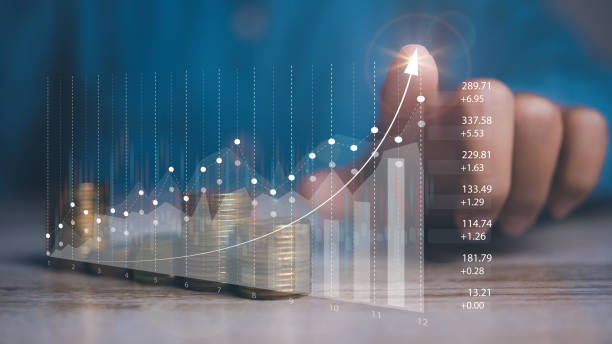 istock Businessman stacking coins with screen forex trading graph financial data. Goal business profit graph development. Stock market, financial growth report. 1938940227