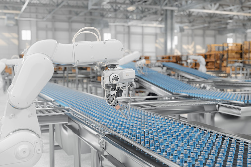 Smart Manufacturing Factory With Robotic Arms Working On Medicine Production On Conveyor Belt