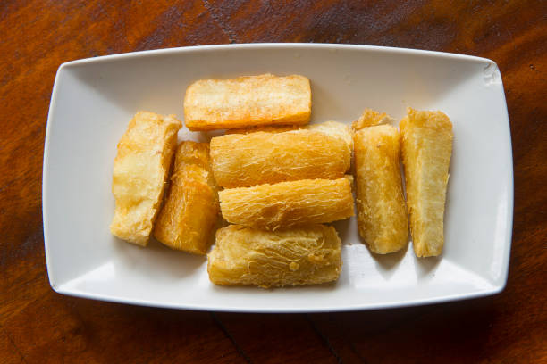 Deep fried cassava root . Brazilian Mandioca Frita (deep fried cassava/ manioc/yuca). Feijoada side dishDeep fried cassava root . Brazilian Mandioca Frita (deep fried cassava/ manioc/yuca). Feijoada side dish