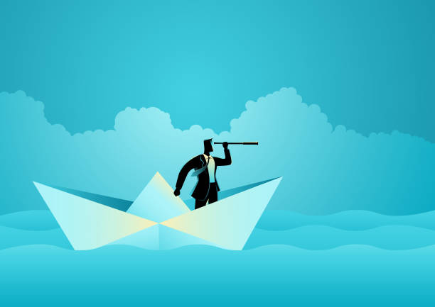 istock Businessman silhouette Origami Ship Telescope 1939003981