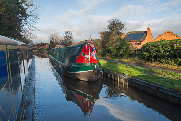 istock Narrowboat on a British canal in rural setting 1939004042