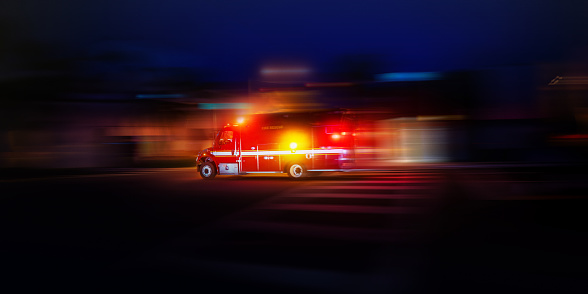 Motion blur speeding ambulance USA