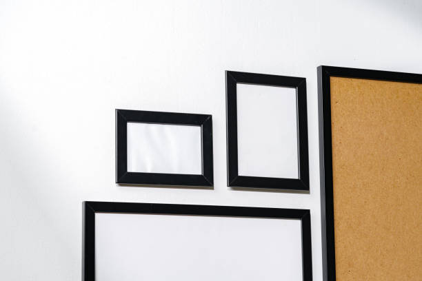 istock Set of black frames on white wall with copy space 1939053034