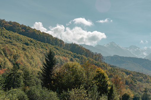 View of the Fogaras Mountains, the tallest mountain range in Romania from the valley. A mountain pass crosses the range and takes visitors over to the southern side of the mountains.