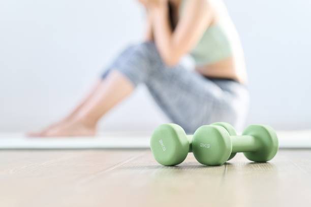 istock A woman feels depressed because her home training doesn't go well 1939073829
